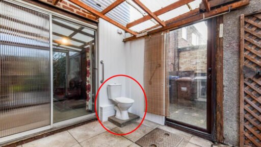 A three bedroom home priced at £130,000 has caught attention for its unusual layout, featuring a fully plumbed toilet sitting openly inside a glass conservatory